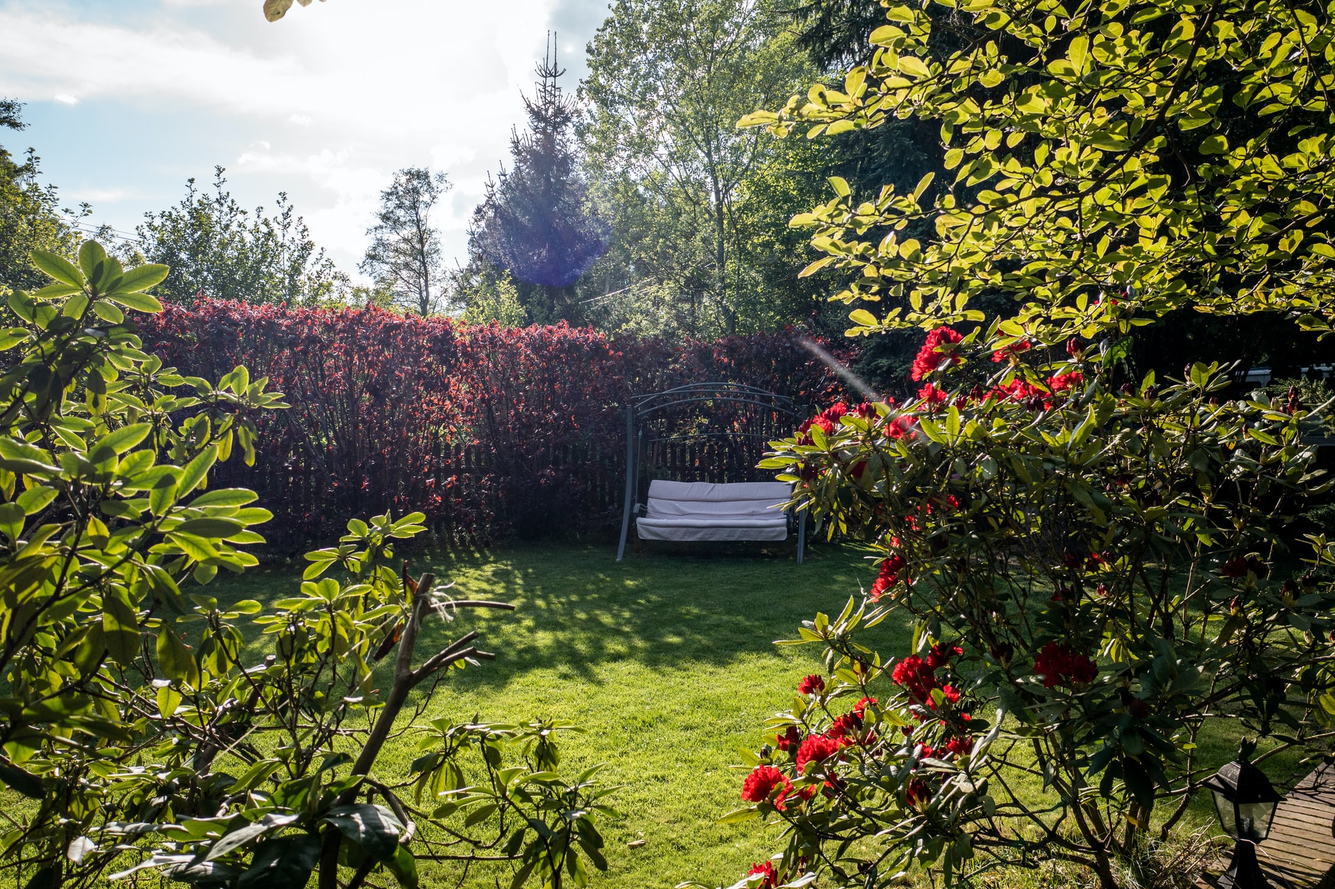 Gray bench in a front garden